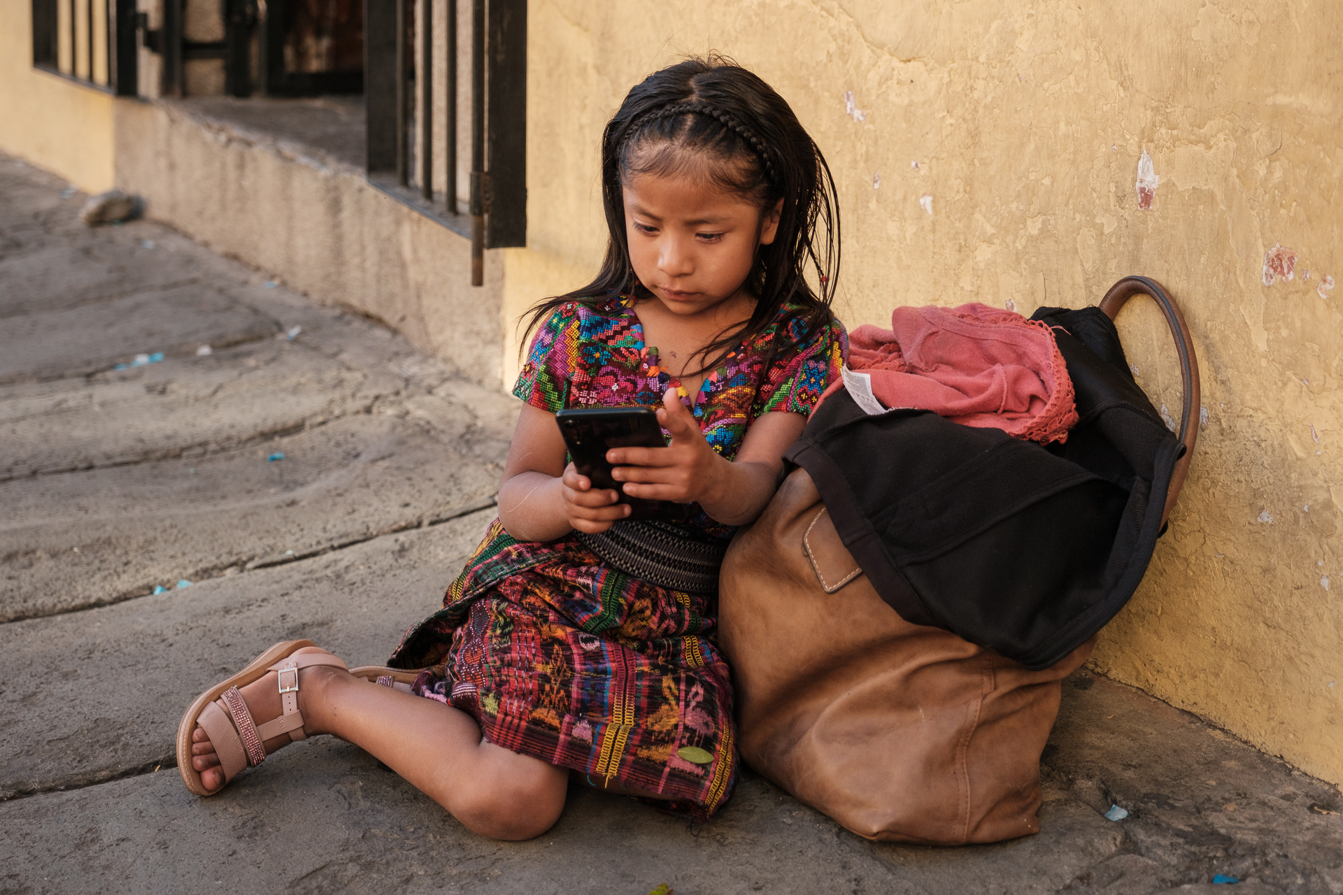 Antigua - Girl with mobile phone