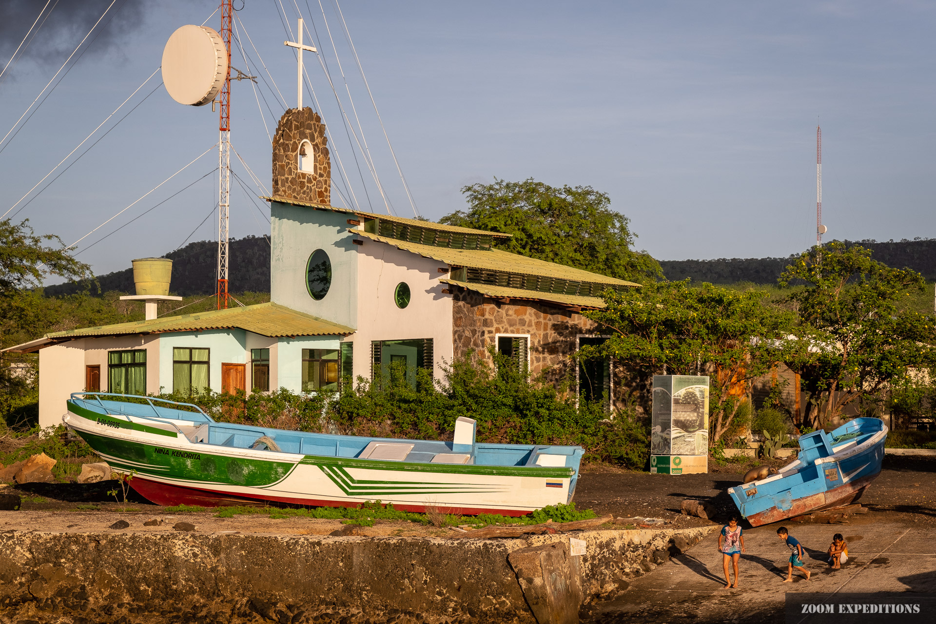 Fernandina Galapagos church and kids sunset