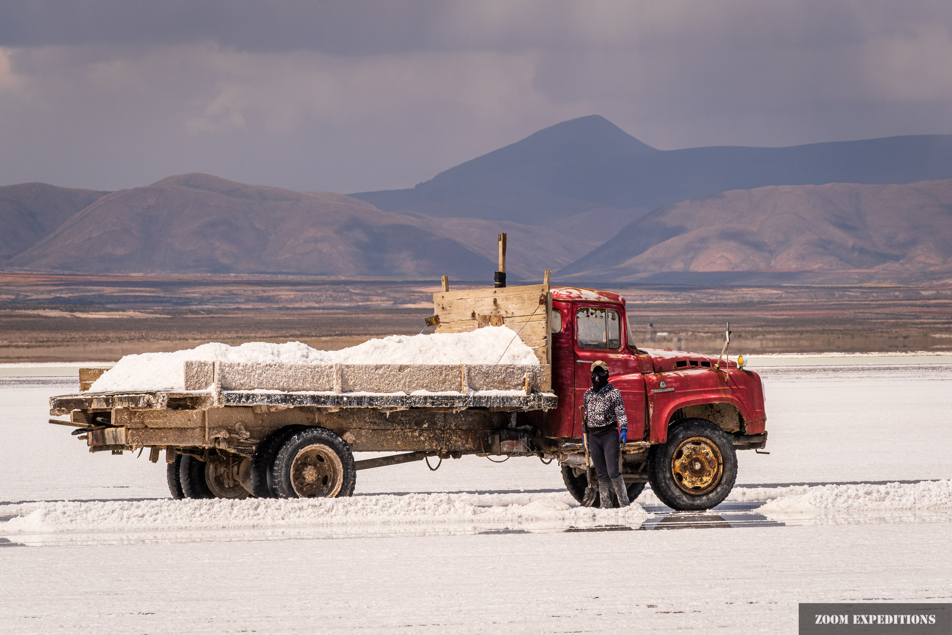 salt worker with truck, Salar de Uyuni, Bolivia