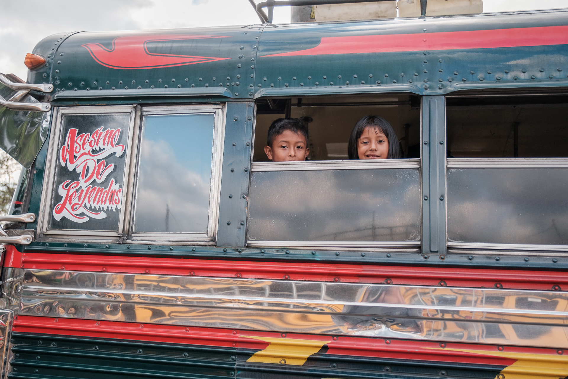 Two Kids in a bus in Guatemala.