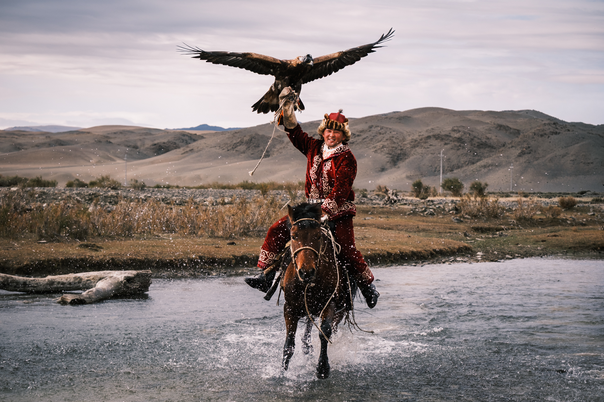 Eagle Hunter crossing a stream
